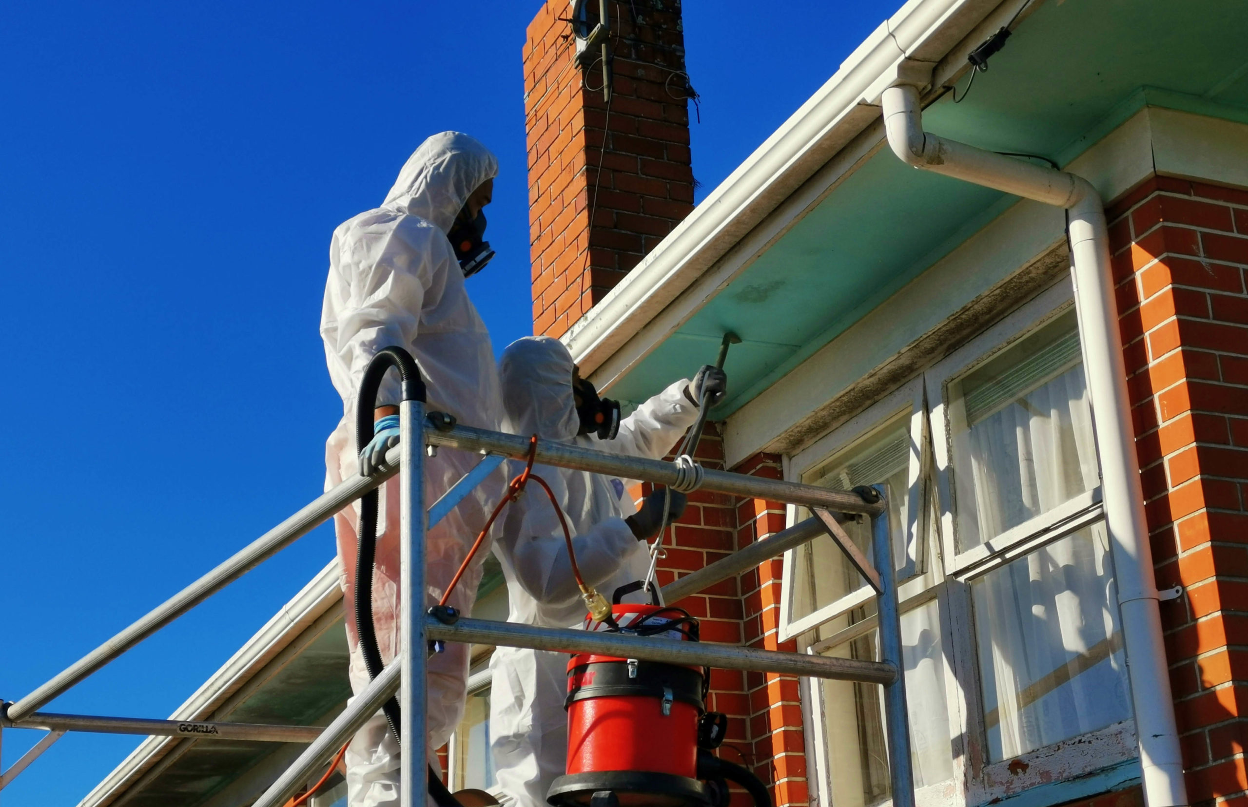 AIIZ specialist performing asbestos removal on site