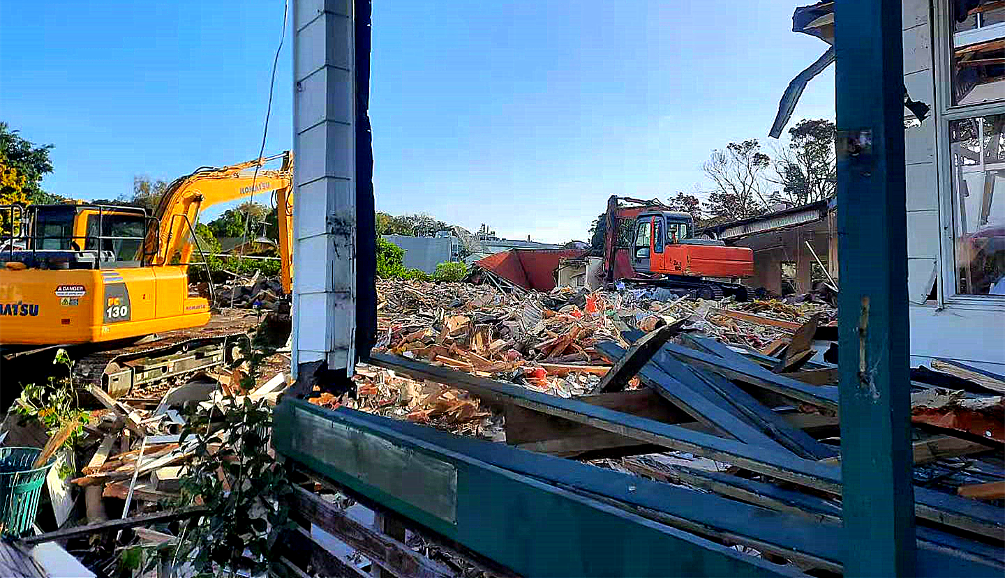AIIZ excavator at work on a residential demolition site in Auckland